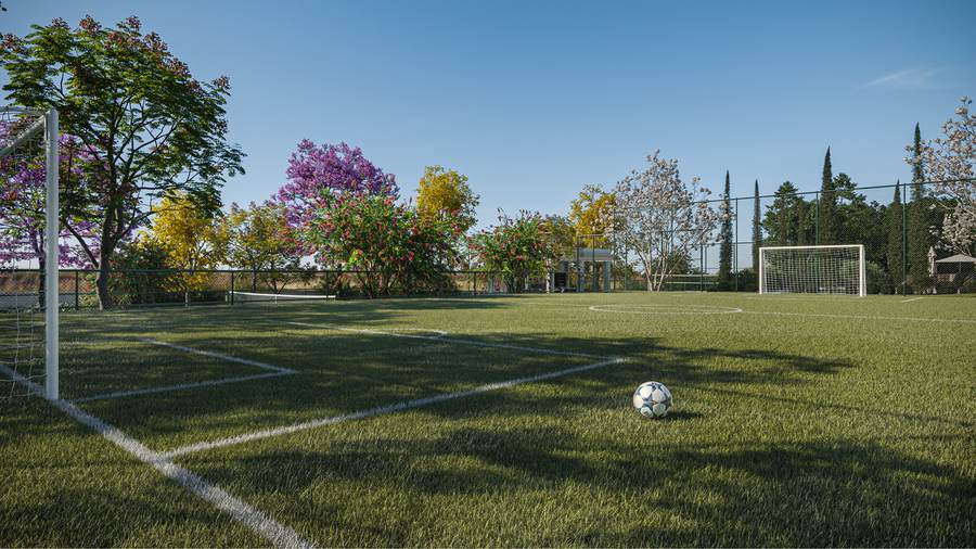Campo de futebol gramado do Terras de São Bento Indaiatuba com árvores ao fundo